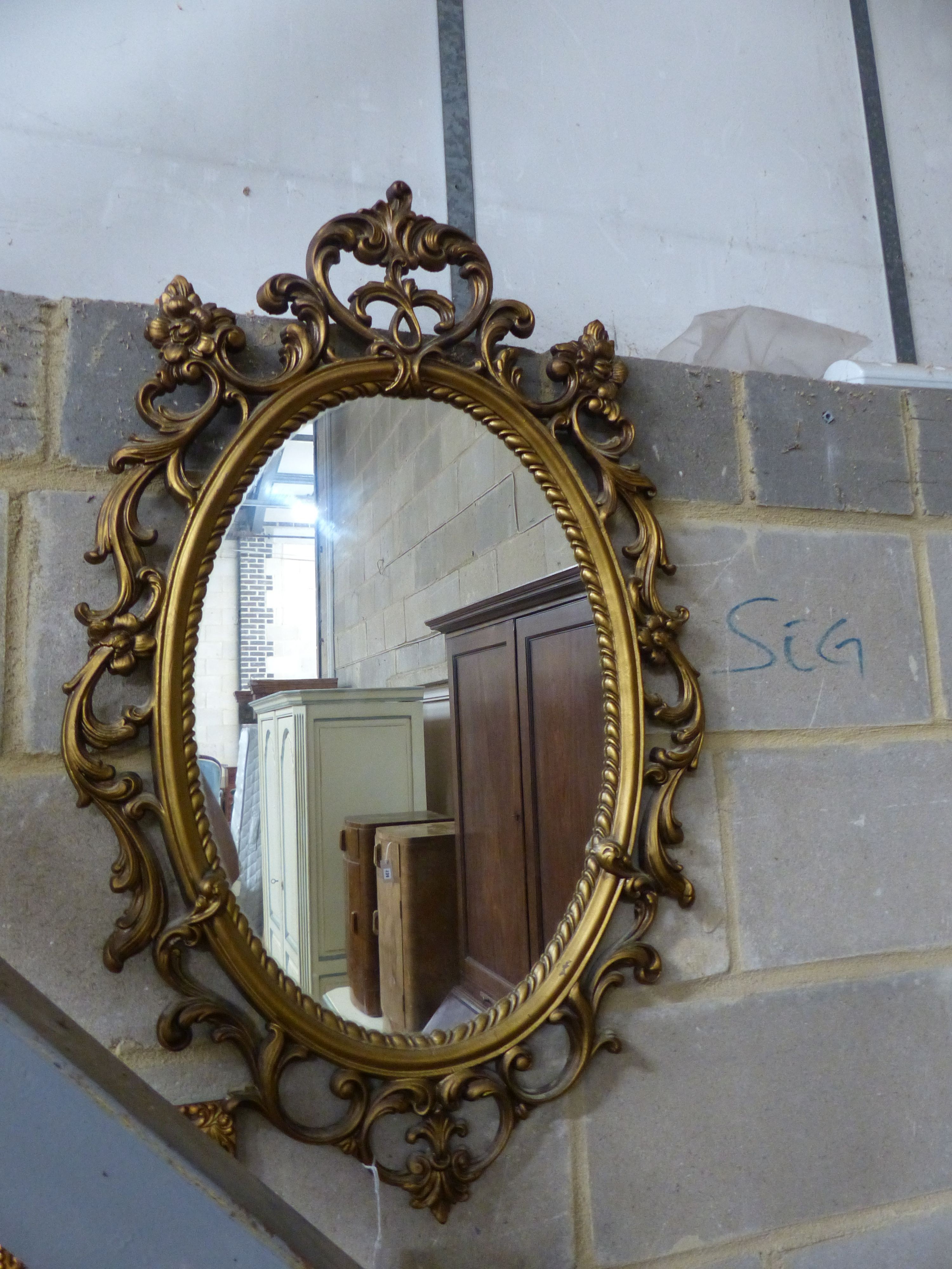 Three reproduction gilt framed wall mirrors, largest W.63cm H.85cm